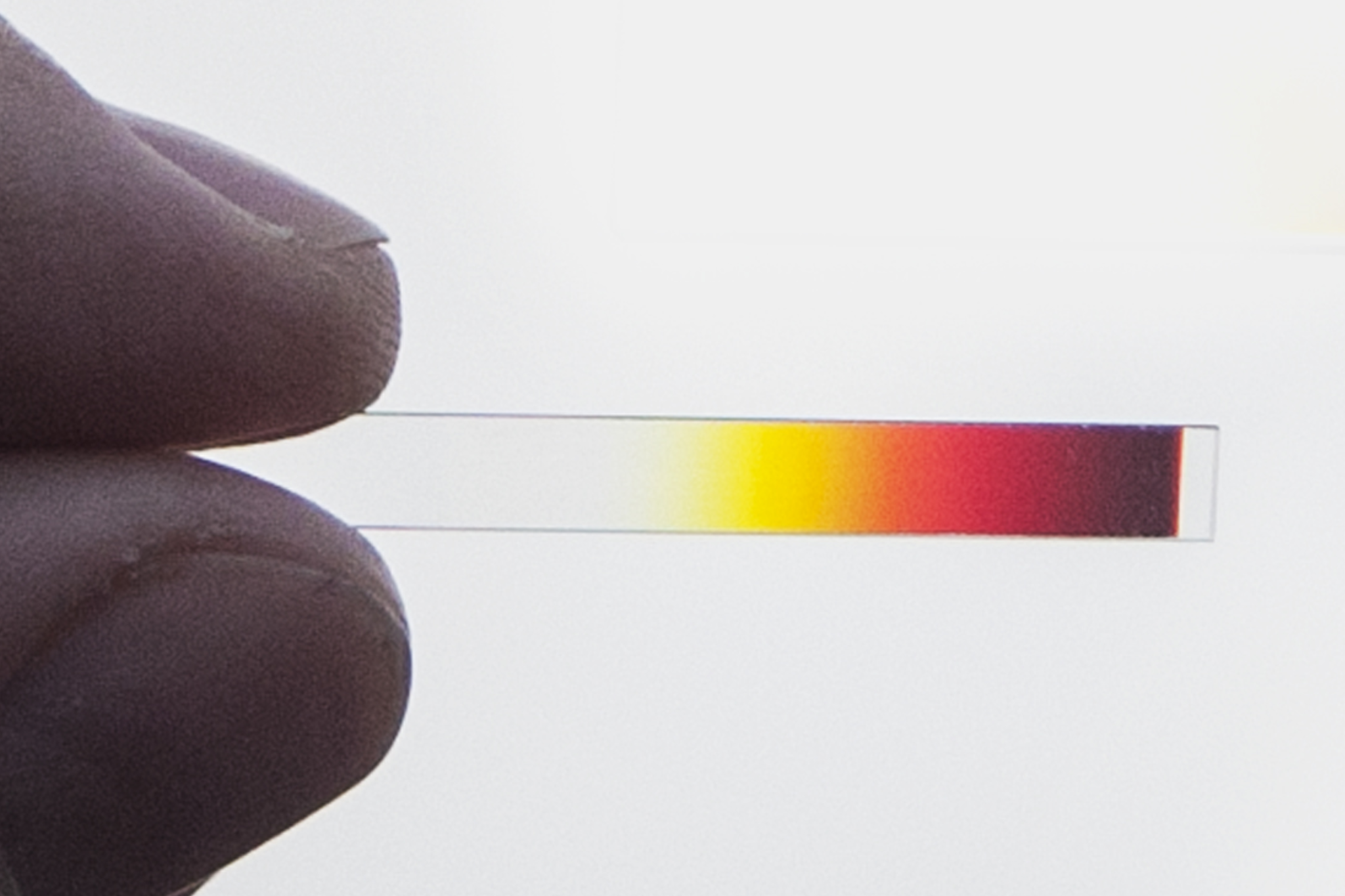 Linear variable edge filter held with two fingers